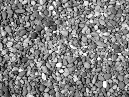 Pebble ground pattern, gray gravel floor material, black soil surface, natural garden land backdrop, grey stone wall background, marble rock soil textureの写真素材