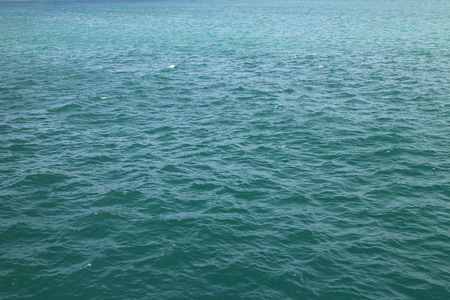 Wide large blue wave sea view, glitter green ripple ocean surface, river texture background, water lake pattern backdrop, nature seascape wallpaper, fresh marine landscape, cyan aqua panorama bannerの写真素材