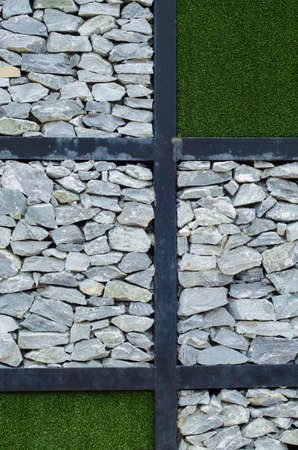 The stone and green grass on the wallの写真素材