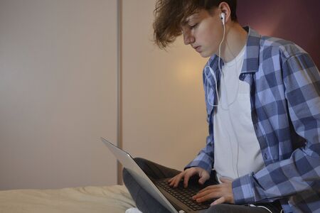 Young man with his laptop at home