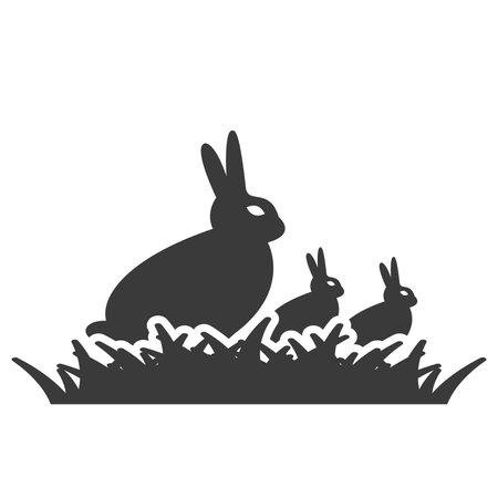 Rabbit with two baby rabbits sits in the grass glyph icon isolated on white background.Vector illustration.のイラスト素材