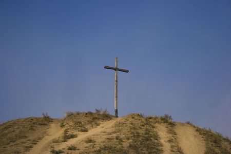 wooden cross on a hillの写真素材