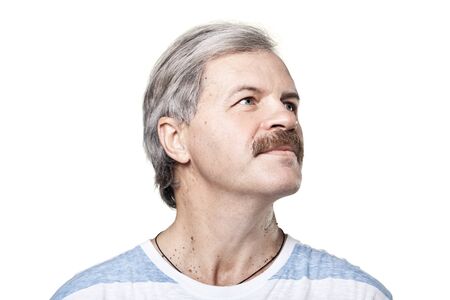 mature man look into the distance isolated on white backgroundの写真素材