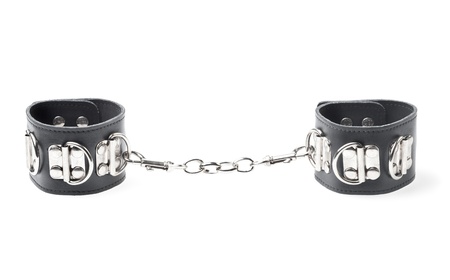 black leather handcuffs isolated on white background