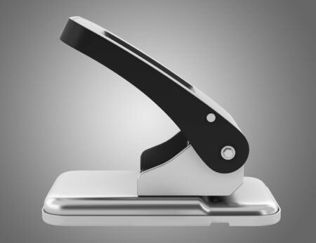 paper hole punch isolated on gray backgroundの写真素材