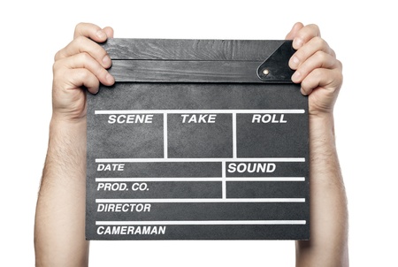 two male hands holding movie production clapper board isolated on white backgroundの写真素材