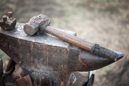 hammer on blacksmith anvil  の写真素材