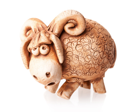 brown ceramic ram doll isolated on white backgroundの写真素材