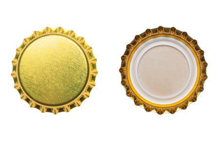 yellow bottle caps isolated on white backgroundの写真素材