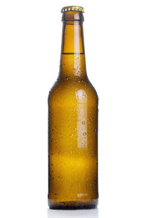 brown beer bottle with drops isolated on white backgroundの写真素材