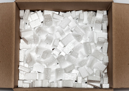 white styrofoam pellets in cardboard boxの写真素材