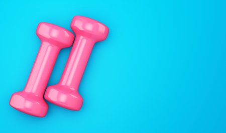 Pink dumbbells isolated on blueの写真素材