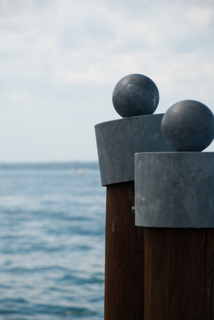 Wooden poles in the waterの写真素材