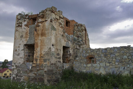 ruins of an ancient Ukrainian  castle on the background of stormy skyの写真素材