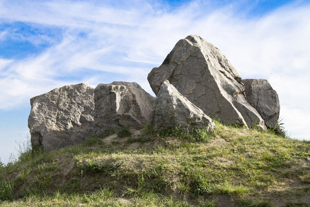 several large stones on sky backgroundの写真素材