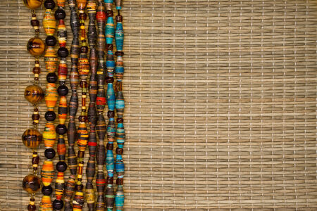 straw mat decorated with a border of beadsの写真素材