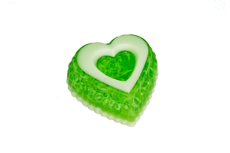 soap as a green heart on a white backgroundの写真素材