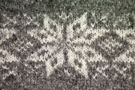 background gray knitted jacquard pattern closeupの写真素材