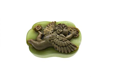 green soap with decoration in the form of a brown angelの写真素材