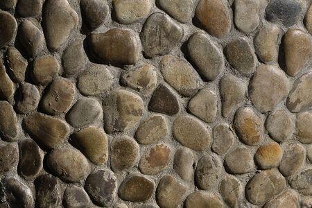 wall of the large brown stone close upの写真素材