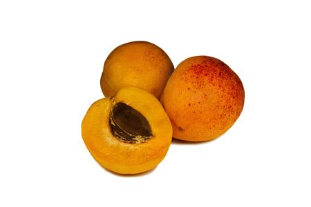 Three apricot close up on a white backgroundの写真素材