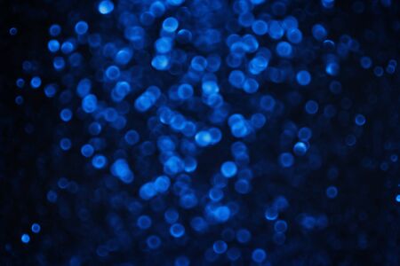 blue festive glowing blurred background closeupの写真素材