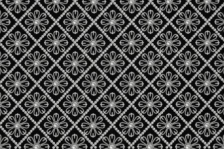 black background with white pearls pattern closeupの写真素材