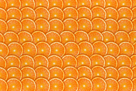 orange background chopped circle closeup oranges