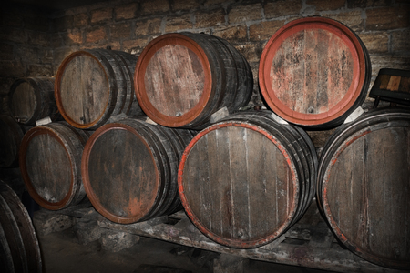 lying barrels of wine in a cellarの写真素材