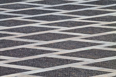 abstract background gray cobblestones, are inscribed squares