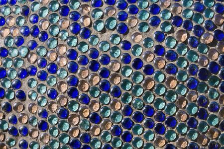 cement surface with colored glass decoration closeupの写真素材