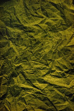 abstract background texture of crumpled green paper closeupの写真素材