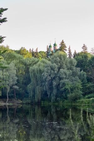 landscape with a lake and the Orthodox Church on the shore