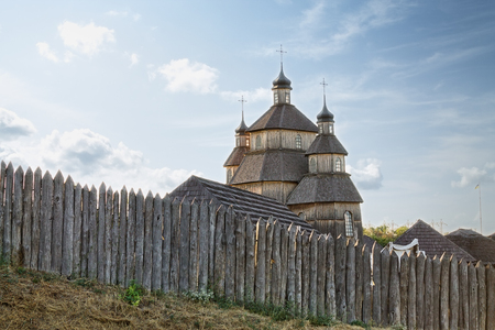 Fence and Church in Zaporozhye Sech on Khortitsa, Ukraineの写真素材