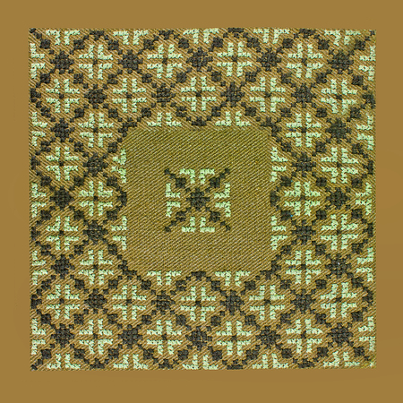 abstract green background with embroidered floral frame closeupの写真素材