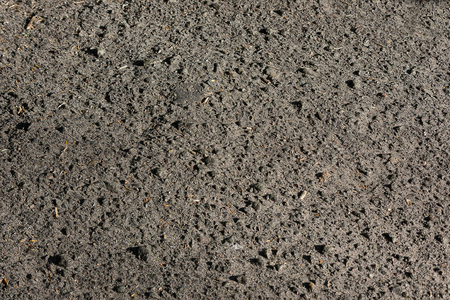 abstract texture background brightly lit asphalt closeupの写真素材