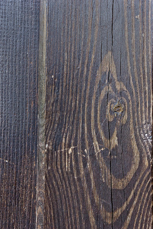 Texture of a dark brown wooden surface closeupの写真素材