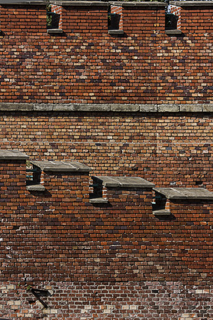 background old brick fortress wall with dents close-upの写真素材