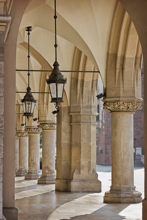 Gallery with columns and lanterns.  Market building on the Market Square in Krakow, details.  Sights of Polandの写真素材