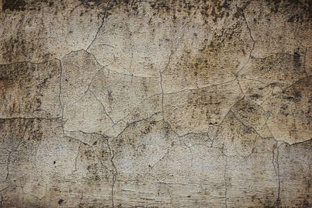 texture of an old gray concrete wall close-up in spots and scratchesの写真素材