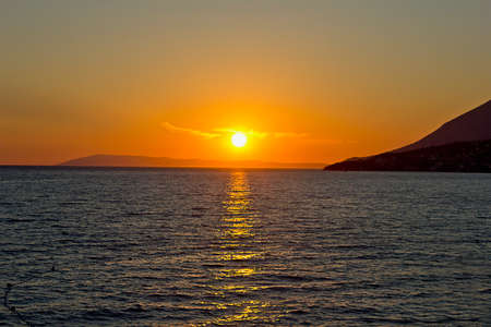 landscape a bright colourful sunset at sea. Adriatic Sea, Croatiaの写真素材