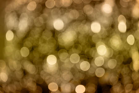 blurry abstract background golden holiday lightsの写真素材