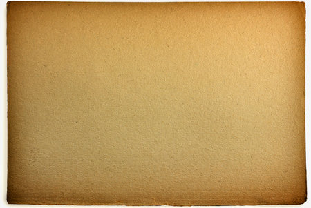 the background of a sheet of old yellowed paper in close-up. A blank piece of paper.の写真素材