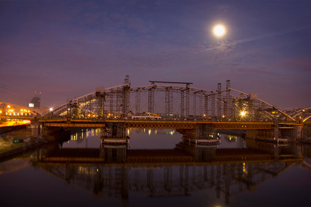 moonlit night scenery with the night lights of the bridge over the Vistulaの写真素材