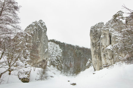 winter landscape with snow-covered rocks. Mountains in winter on a cloudy dayの写真素材