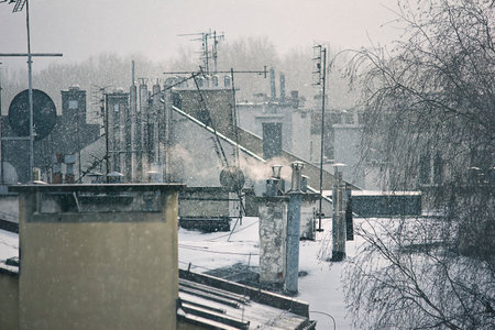 view of the roofs of the old city in winter under the snowの写真素材