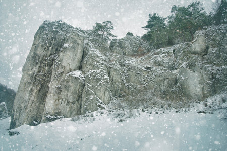 winter landscape with snow-covered rocks. Mountains in winter on a cloudy dayの写真素材