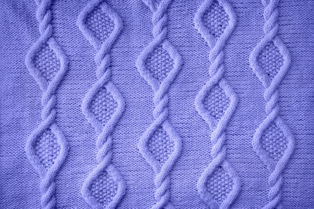 Lilac background knitted fabric with arana pattern close-upの写真素材