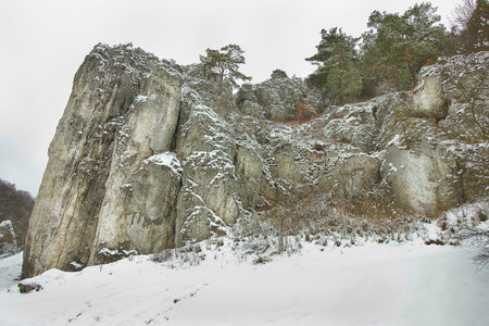 winter landscape with snow-covered rocks. Mountains in winter on a cloudy dayの写真素材