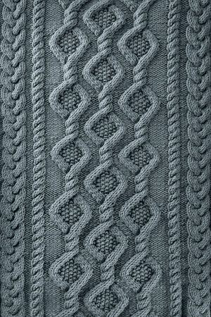 blue  background knitted fabric with a pattern. Knitted Arans close-upの写真素材